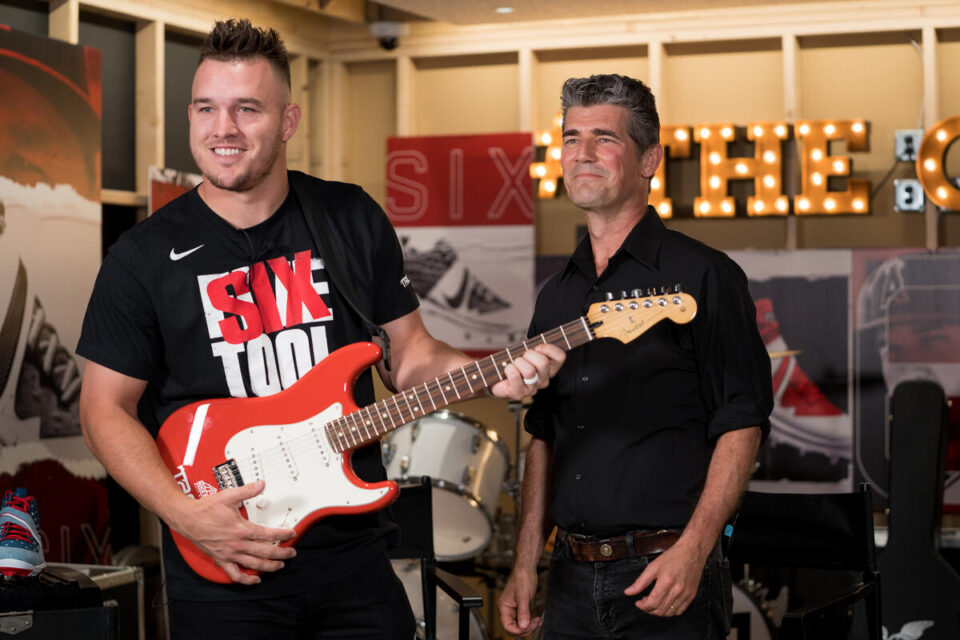 LA Angels' Mike Trout shows off a custom guitar after debuting his latest baseball cleats during MLB All-Star Weekend in Cleveland.